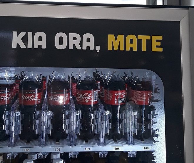 Coca-Cola vending machine in New Zealand with the words "Kia Ora, Mate." Translation fail because "mate" means "death" in Māori.