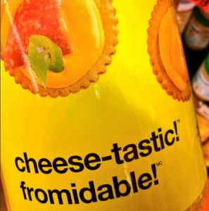 Edible product with the words "cheese-tastic!" and "fromidable!" on packaging. "Fromidable!" play on words "fromage" (cheese in French) and "formidable!"