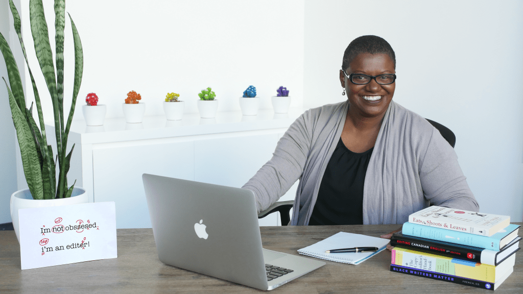 Photo of copy editor and proofreader Debbie Innes at her desk.