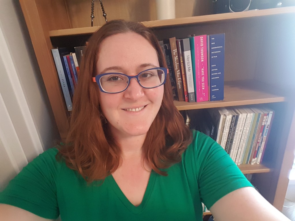 Amanda Clarke in front of a bookcase