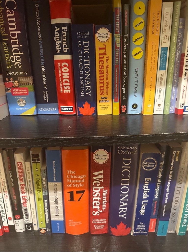 Books on two shelves of a bookcase.