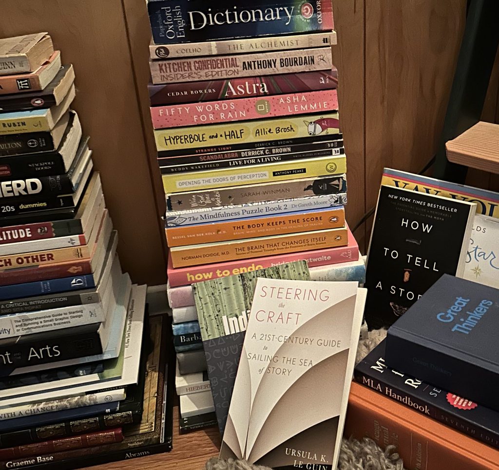 Some stacks of books on the floor. 