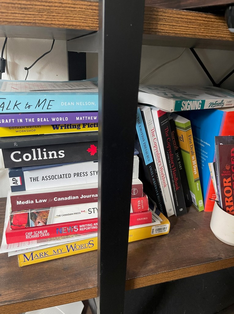 Assorted books on a shelf.