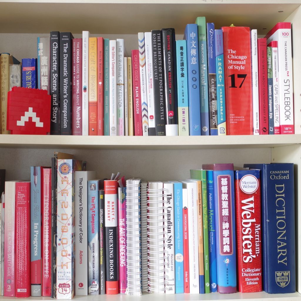 Two rows of books on Ambrose Li's  bookshelf. 