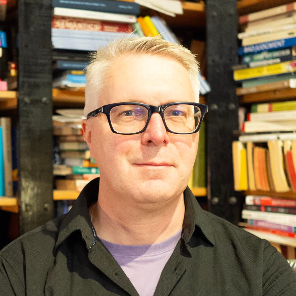 A headshot of James Harbeck.