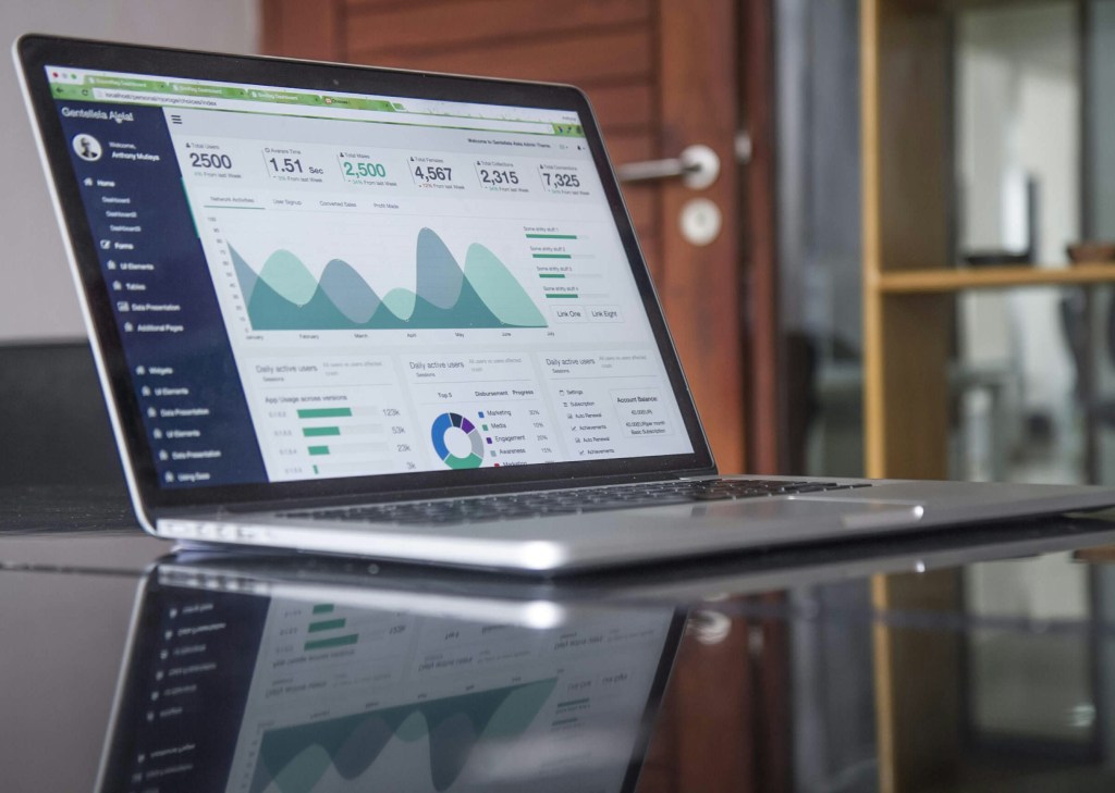 An open laptop with SEO stats on a table.